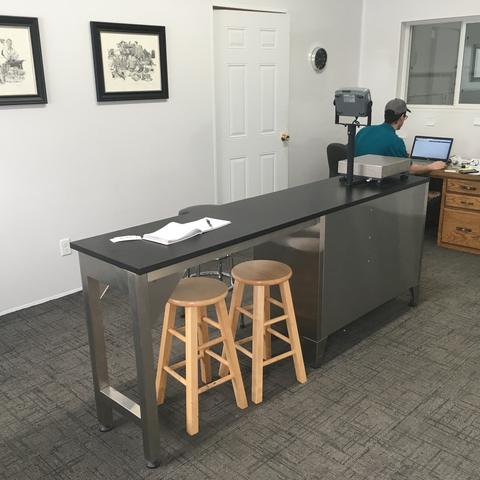 The front room with a steel counter and stools