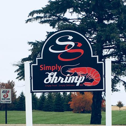The Simply Shrimp sign at the end of the driveway